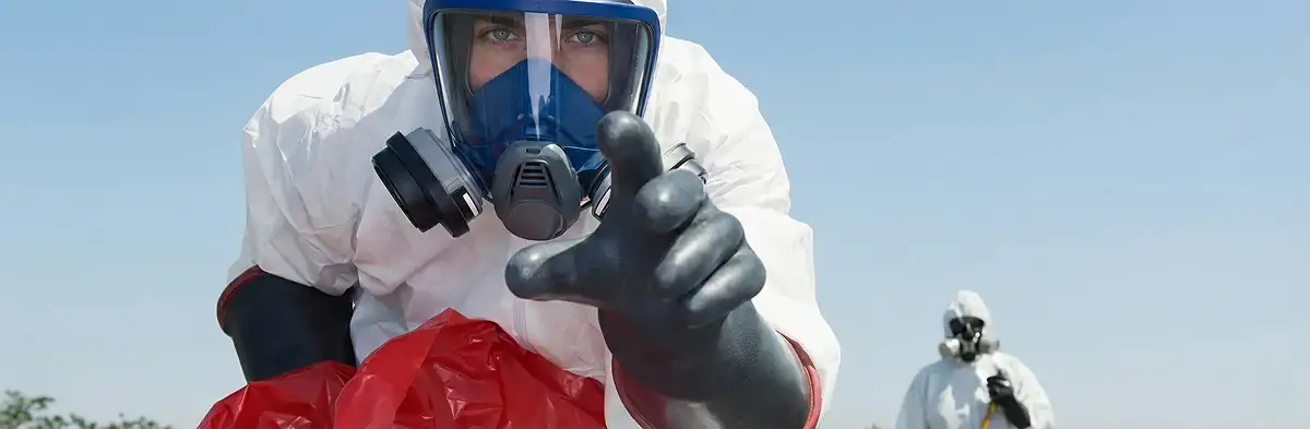sewage clean up technician wearing protective gear handling biohazard materials in Boise, ID